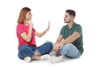 Wall Mural - Hearing impaired friends using sign language for communication isolated on white