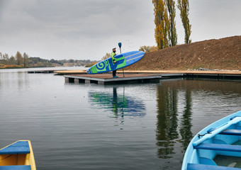 Wall Mural - Man with paddle board