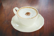 © akkalak - hot coffee mocha with foam milk in vintage cafe(vintage effect)