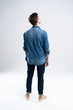 © opolja - back view of a casual man standing on white background.