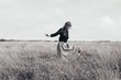 © Victoria Harrison - Woman walking alone in meadow