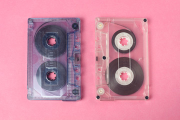 group of two audio retro vintage cassette tape 80s style on pink background