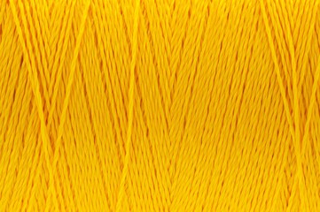 Wall Mural - Macro picture of thread texture dark yellow color background