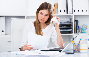 Wall Mural - Upset young businesswoman in office