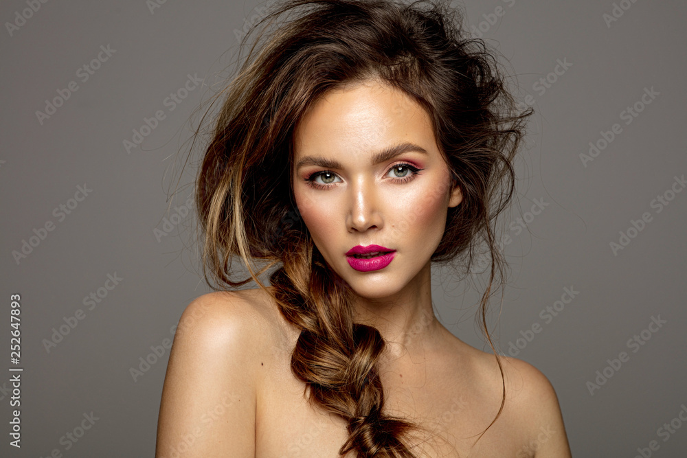 Beauty portrait of female model with messy hair and braid - obrazy, fototapety, plakaty 