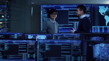 Fototapete - In the System Control Room Project Manager and IT Administrator Have Discussion. Monitoring Station Has Capacity for Global Data and Monitoring, Every Interaction is Shown in Real Time on Displays