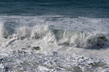 Wall Mural - Foamy Atlantic ocean water, Portugal coast.