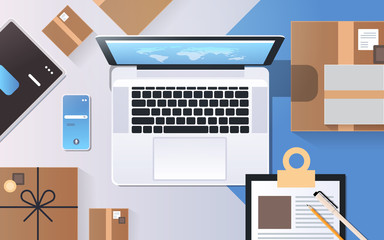 Wall Mural - online shopping express shipping delivery service concept top angle view desktop laptop smartphone c
