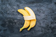 Two bananas isolated on dark background