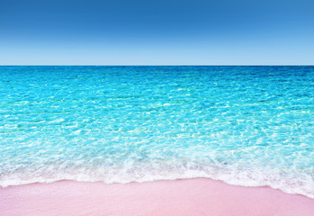 Soft blue ocean wave with tropical pink sandy beach