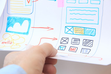 software engineer developer designing application for modern smartphone. ux ui design apps.