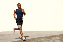 Healthy Young Black Man Running Outside On Street