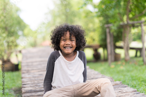 Portrait Of A Cute African American Little Boy Smiling At Nature