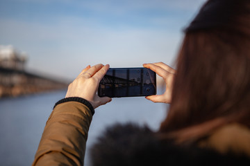 Kiev, Ukraine - March 01, 2019: Brand new Samsung Galaxy S10. Girl taking photo.