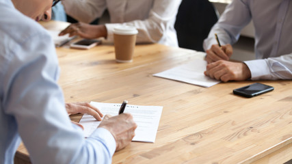 Sticker - Businesspeople sitting at table during meeting reached agreement signing contract