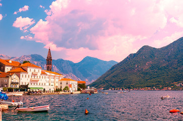 Wall Mural - Scenic panoramic view of the historical city of Perast, located in the Bay of Kotor on a sunny day with blue sky and white clouds in summer, Montenegro, southern Europe