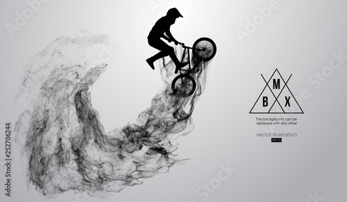 Fotografía Abstract silhouette of a bmx rider on the white background from particles, dust, smoke, steam
