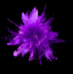explosion of purple powder on black background
