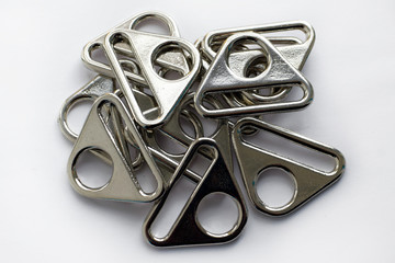 The filled buckles for bags performed by nickel for the industrial purposes and tailoring of products. Metal accessories for backpacks and bags