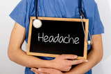 Fototapeta  - Doctor shows information on blackboard: headache.  Medical concept.