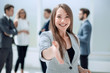 © ASDF - successful businesswoman holding out her hand for a handshake