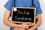 Fototapeta  - Doctor shows information on blackboard: dry eye syndrome.  Medical concept.