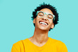 © Carlos David - Portrait of a happy  young man isolated on blue background