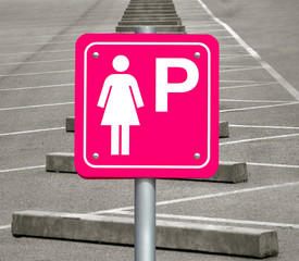 Wall Mural - The pink sign for parking cars for women only. Parking place only for lady at the empty public parking lot.