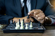 © sabthai - Businessman play chess how  to crash overthrow the competitor