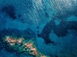 © NBLX - Aerial view of blue and turquoise sea surface