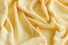 The Yellow Fabric Is Lined With Folds 