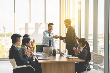 Businesspeople discussing together in conference room during meeting at office.