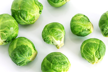 Wall Mural - The Fresh green brussel sprouts vegetable on white background