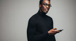 © Jacob Lund - Handsome african man with a smart phone