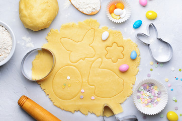 Wall Mural - Making of Easter Cookies, Baking Background, Dough, Cookie Cutters, Sugar Sprinkles