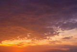 Fototapeta Na sufit - dramatic sunset with golden clouds