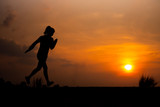 Fototapeta Konie - young fitness woman running on sunset seaside trail - Image