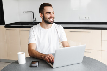 Wall Mural - Happy handsome man freelancer