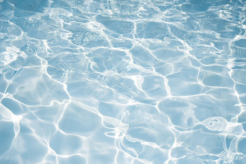 Texture of water in swimming pool for background