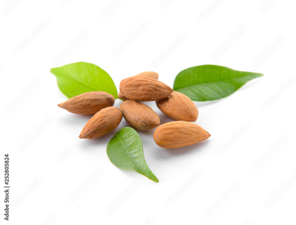 Tasty almonds on white background