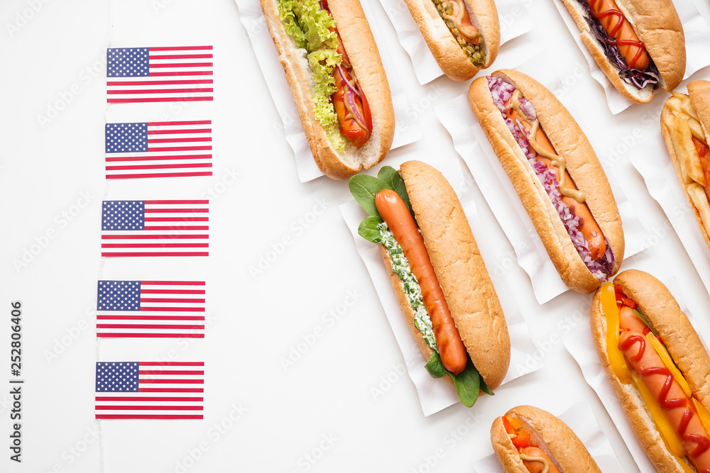 Tasty hot dogs on white background