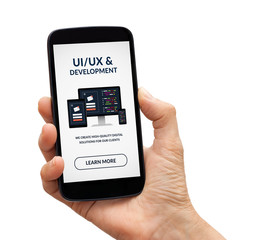 hand holding smart phone with ui/ux design and development concept on screen. isolated