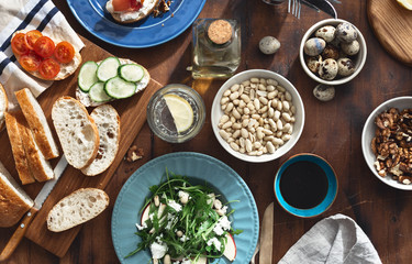 Canvas Print - healthy breakfast lunch Various snacks appetizers arugula salad sandwiches prosciutto vegetables