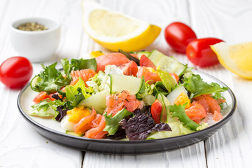 Wall Mural - Salad with salmon, egg and vegetables (cherry tomatoes, cucumber, lettuce), delicious light lunch, healthy food