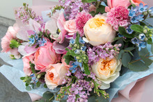Beautiful Rich Elegant Wedding Pink Bouquet, Flowers Arrangement By Florist With Roses, Lilac And Blue Flowers. Floral Background