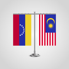 Wall Mural - Table stand with flags of Venezuela and Malaysia. Two flag. Flag pole. Symbolizing the cooperation between the two countries. Table flags