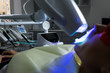 © F8  \ Suport Ukraine - Female receiving teeth whitening procedure. Portrait of a female patient at dentist in the clinic. Teeth whitening procedure with ultraviolet light UV lamp. LED lamp for Teeth whitening procedure