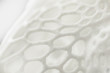 3D printed object close-up, mesh textured abstract background
