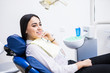 © F8  \ Suport Ukraine - Overview of dental caries prevention. Woman at the dentist's chair during a dental procedure. Beautiful Woman smile close up. Healthy Smile. Beautiful Female Smile