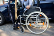 © didesign - Young handicapped man reaching for his wheelchair